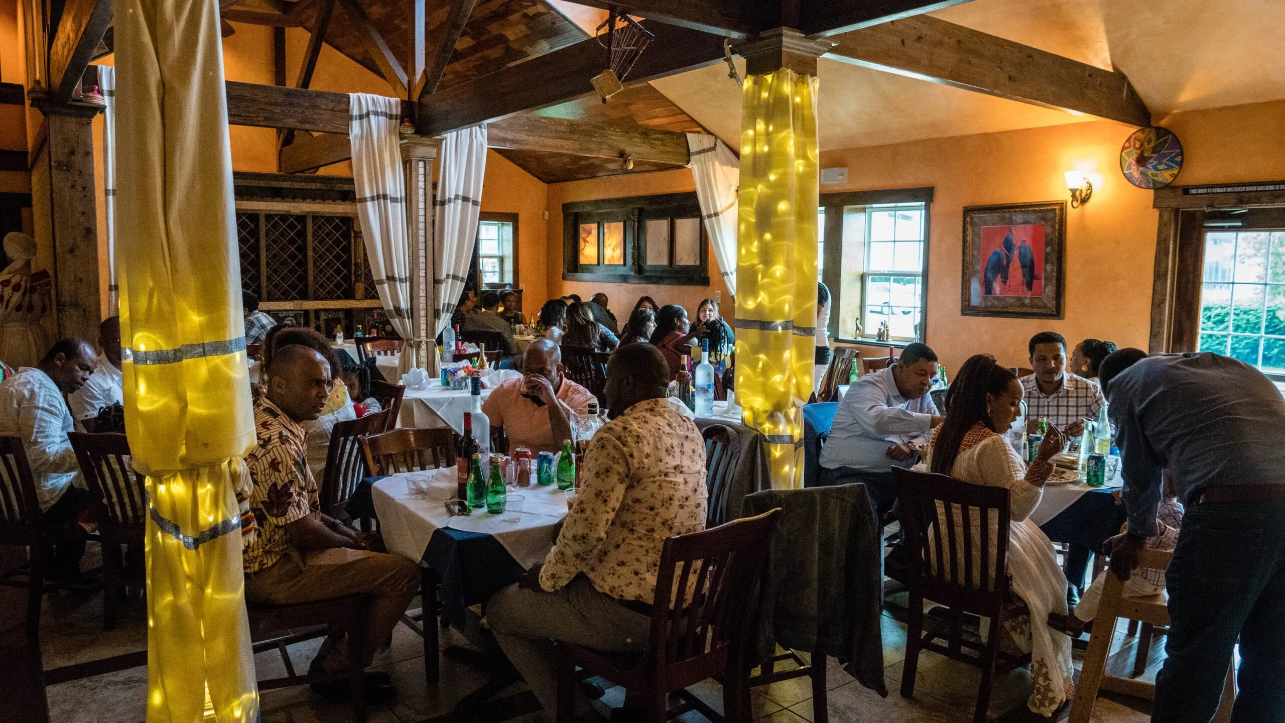 Guests gathering in the Blue Nile dining room