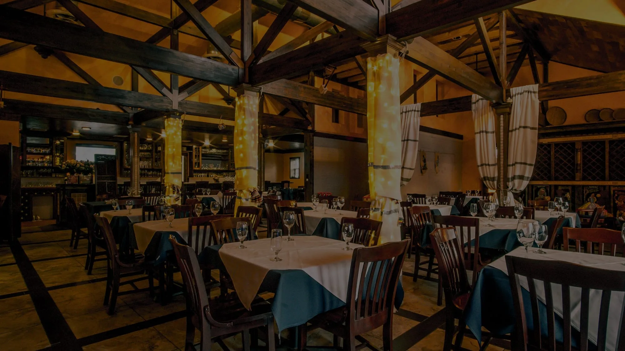 The warmly lit dining room at Blue Nile at River Oaks